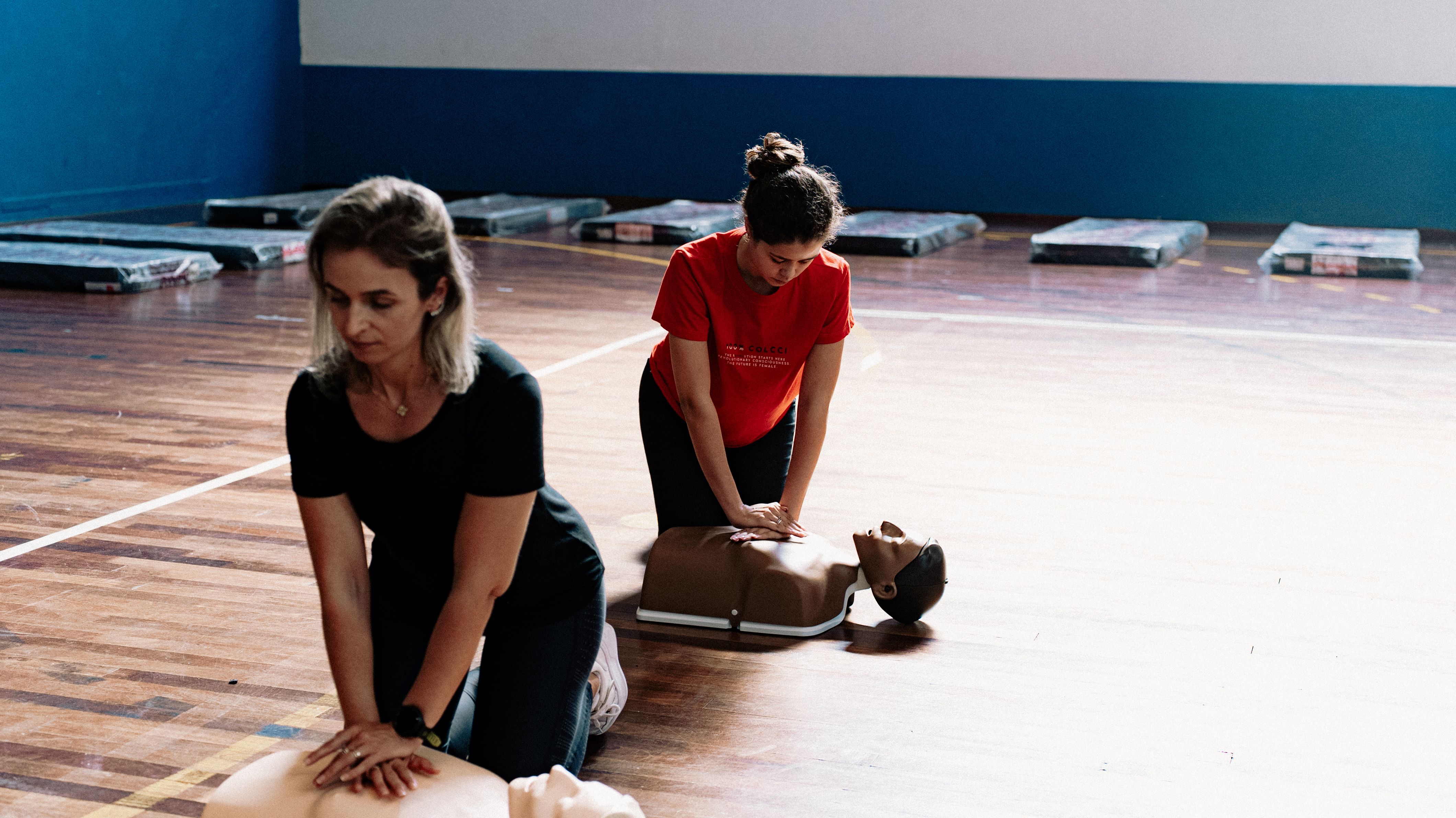 School staff practising emergency first aid — anaphylaxis training schools must provide under Benedict's Law UK